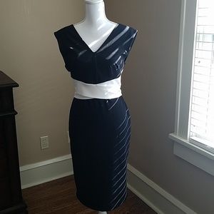 Black dinner party dress with white tie back bow.